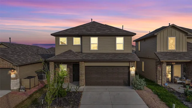 a front view of a house with yard