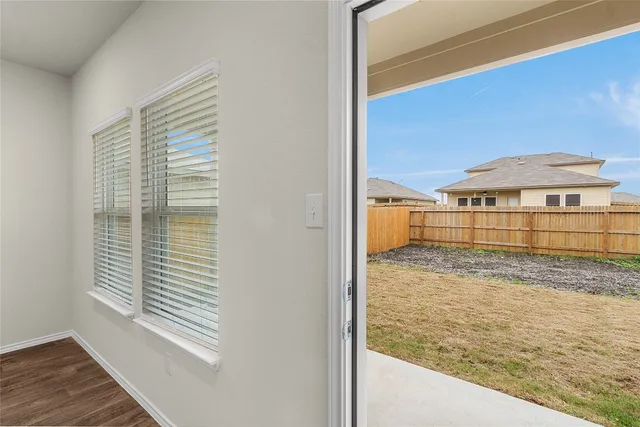 an aerial view of a house with swimming pool