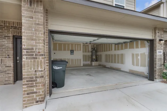 a view of a white house next to a yard