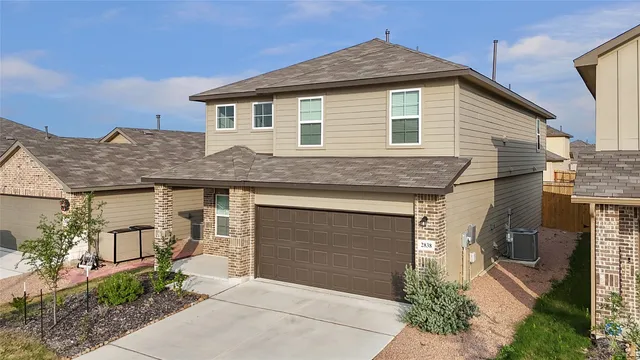an aerial view of residential houses with city view