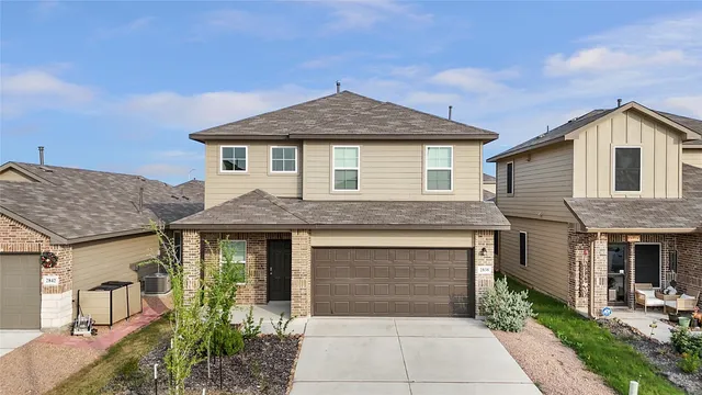 a front view of a house with yard