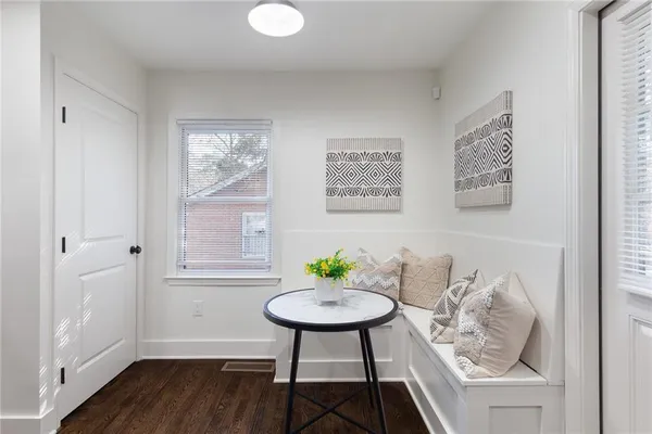 a room with furniture and a potted plant