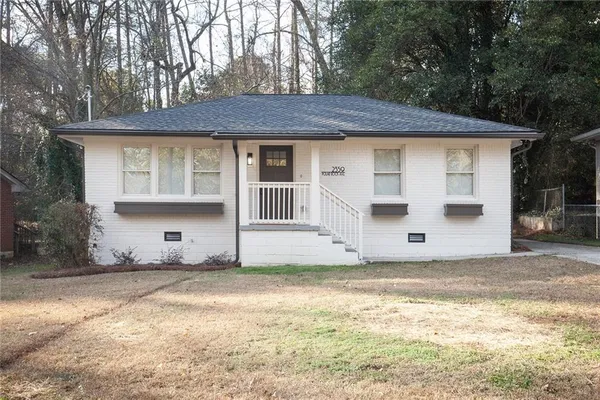 a house with trees in the background