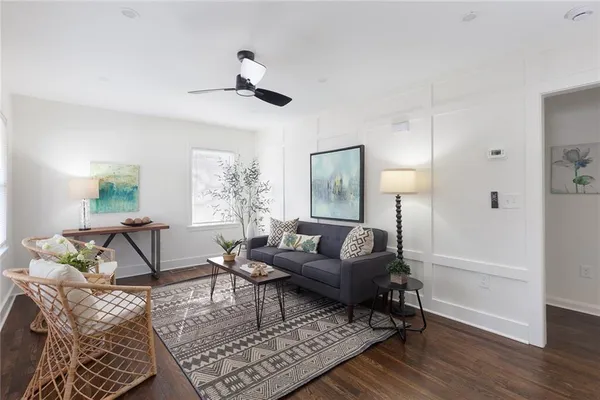 a living room with furniture and a window