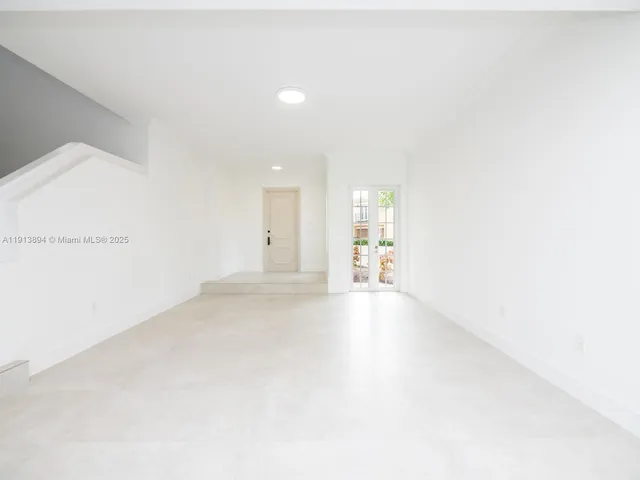 a kitchen with granite countertop a sink and a stove top oven