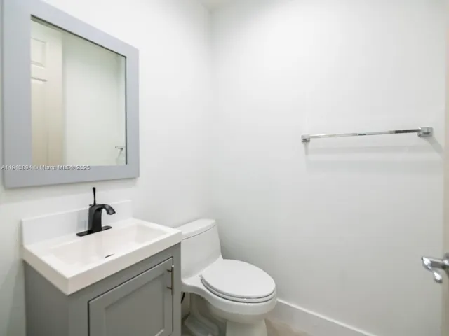 a view of a bathroom with a bathtub and shower