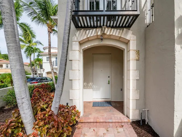 a view of a pathway both side of house