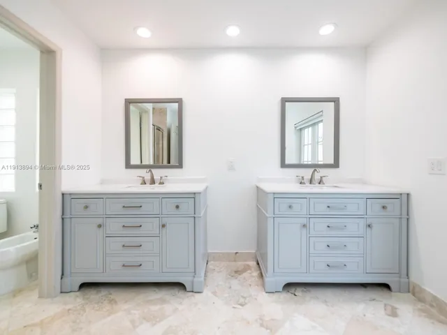 a view of a bathroom from a hallway