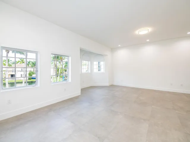a view of a house with a swimming pool and a yard