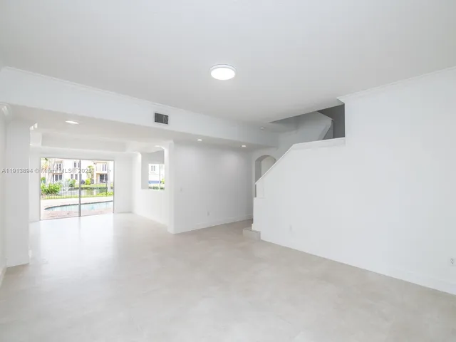 a view of a floor to ceiling window with wooden floor