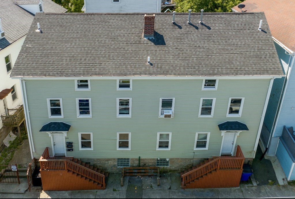 129 Branch Street Fall River, MA 02721 - Photo 1 of 13 a aerial view of a house with a yard