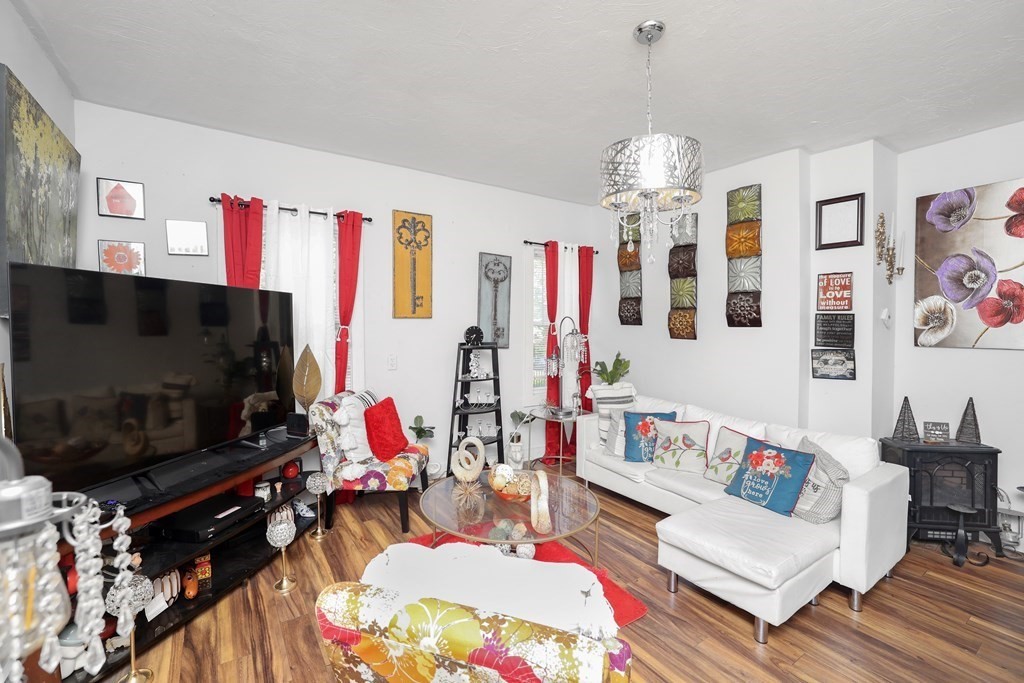 129 Branch Street Fall River, MA 02721 - Photo 3 of 13 a living room with furniture and a flat screen tv