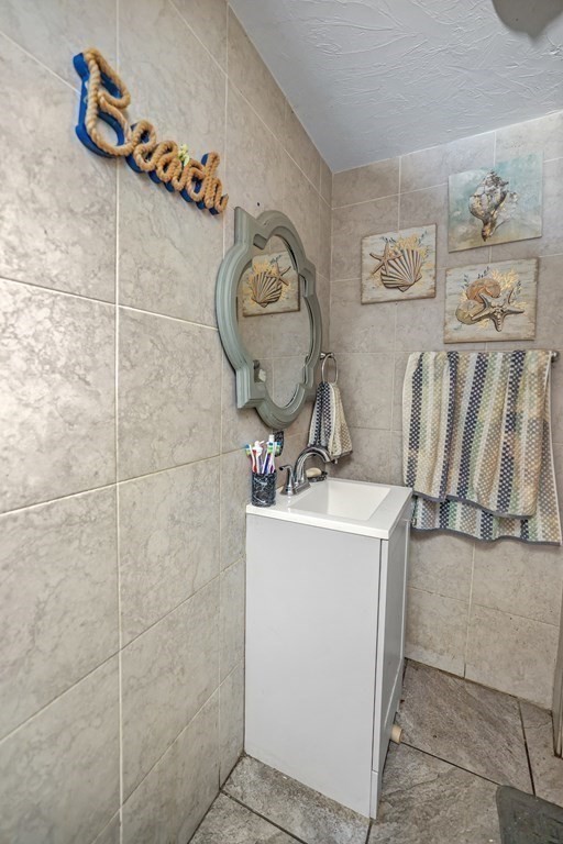 129 Branch Street Fall River, MA 02721 - Photo 6 of 13 a room with storage and utility