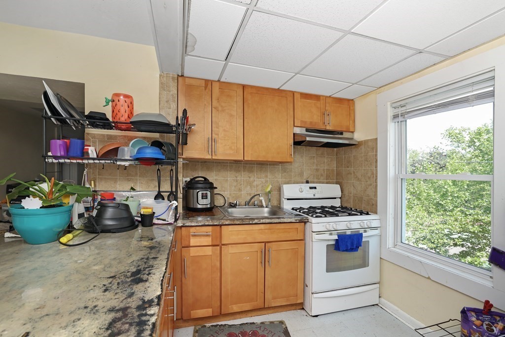 129 Branch Street Fall River, MA 02721 - Photo 8 of 13 a kitchen with lots of appliances and cabinets