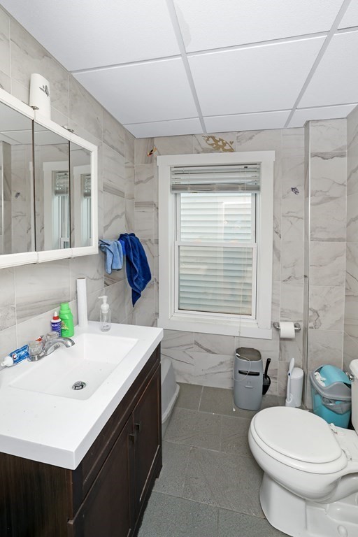 129 Branch Street Fall River, MA 02721 - Photo 9 of 13 a bathroom with a sink a toilet and tub