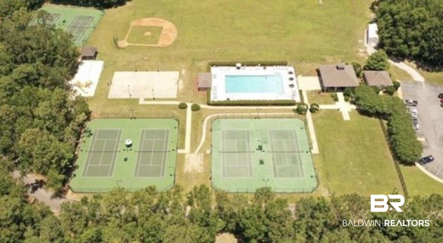 8137 Pine Run Daphne, AL 36527 - Photo 60 of 67 Recreational amenities featuring multiple tennis courts, a baseball field, an outdoor swimming pool, and dedicated parking areas