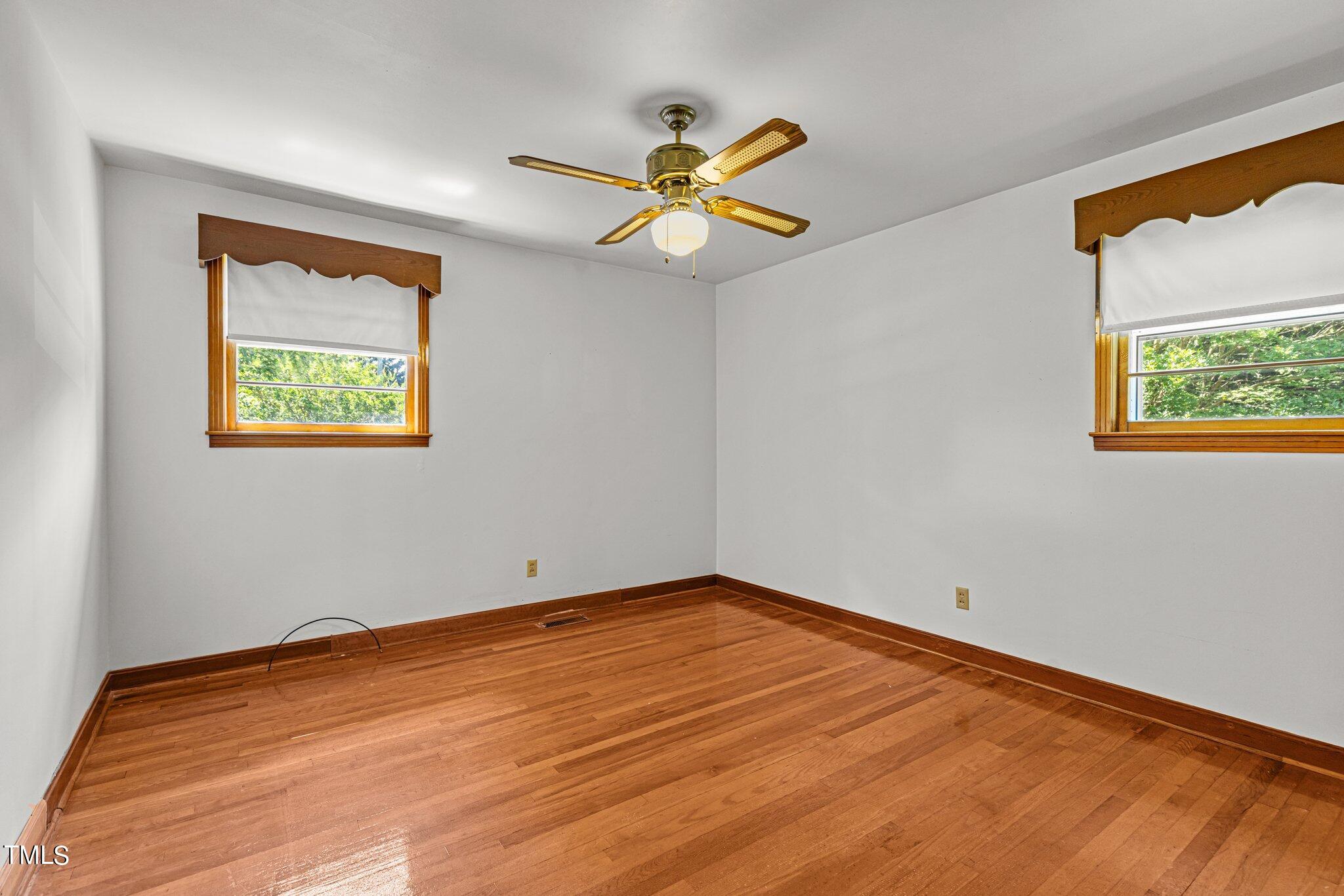 727 Doug Street Roxboro, NC 27573 - Photo 14 of 22 a view of empty room with wooden floor
