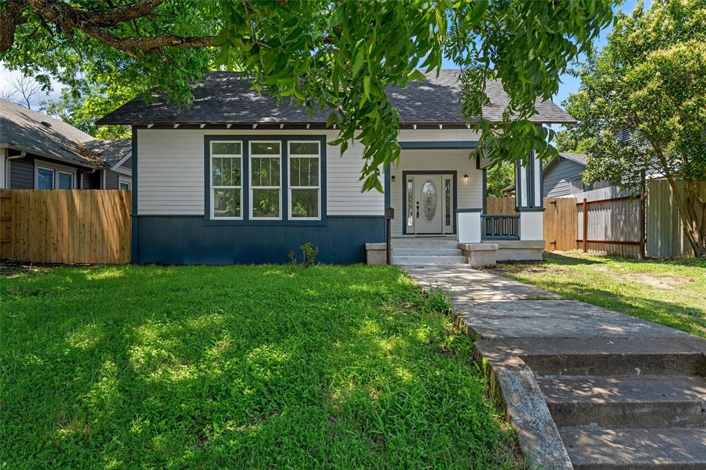 2023 Bosque Boulevard Waco, TX 76707 - Photo 2 of 26 Classic bungalow featuring a covered front porch, white-paneled front door with decorative glass inlay, and a multi-pane window configuration