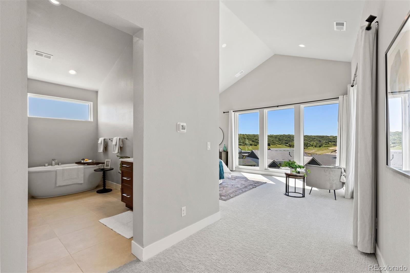 2230 Rim Ridge Drive Castle Pines, CO 80108 - Photo 11 of 33 a room with furniture and a large window