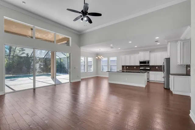 a view of kitchen with cabinets and wooden floor