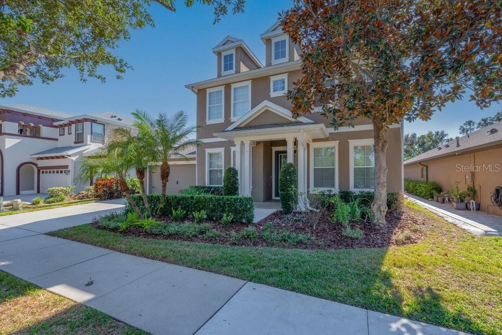 15607 Sunset Run Lane Lithia, FL 33547 - Photo 3 of 54 a front view of a house with garden