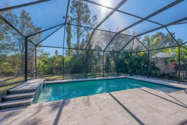 a view of a swimming pool with a patio