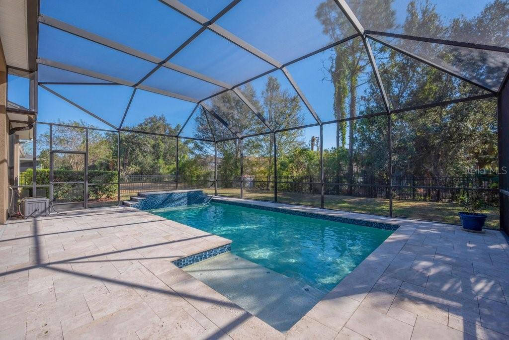15607 Sunset Run Lane Lithia, FL 33547 - Photo 36 of 54 a view of a swimming pool with a patio
