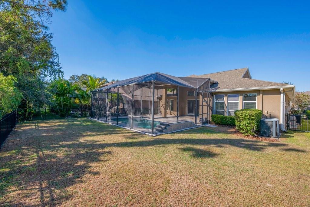 15607 Sunset Run Lane Lithia, FL 33547 - Photo 39 of 54 a view of a house with swimming pool and sitting area
