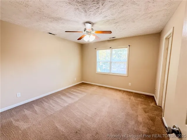 a bathroom with a tub sink toilet and a mirror
