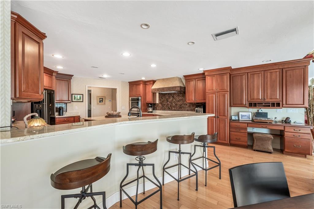 2256 Imperial Golf Course Boulevard Naples, FL 34110 - Photo 14 of 49 Built-in desk area convenient to kitchen & family rooms.