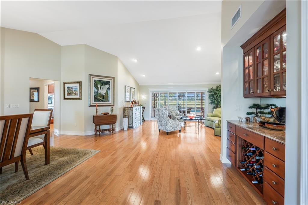 2256 Imperial Golf Course Boulevard Naples, FL 34110 - Photo 19 of 49 Built in & lighted cabinet bar near the dining room