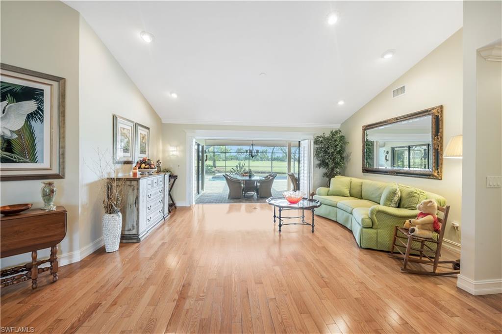 2256 Imperial Golf Course Boulevard Naples, FL 34110 - Photo 21 of 49 Rich wood flooring in a light color...