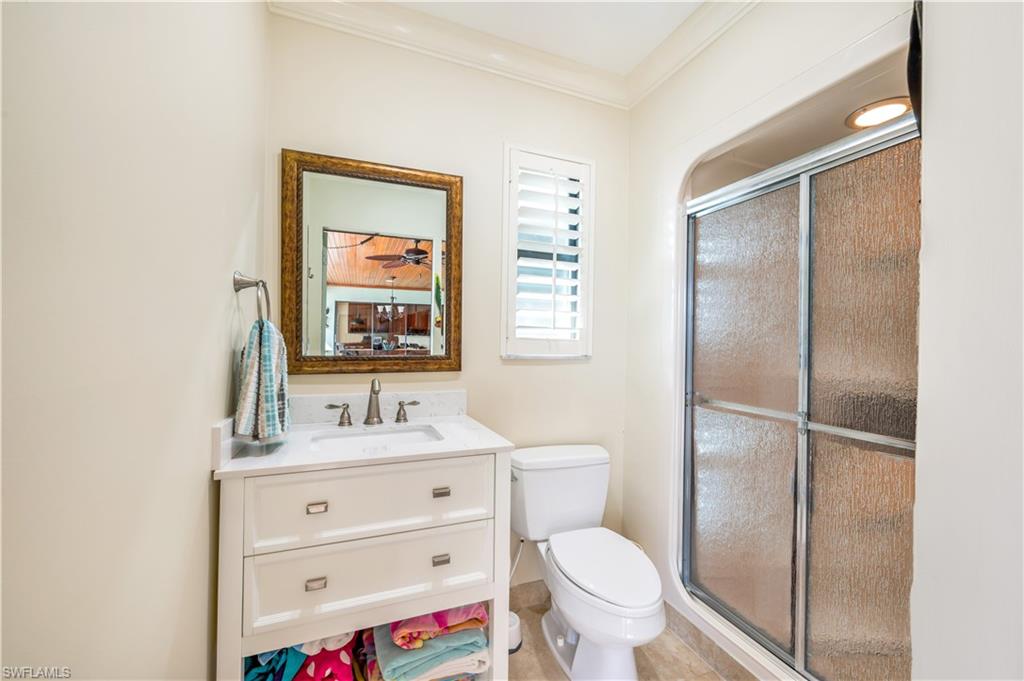 2256 Imperial Golf Course Boulevard Naples, FL 34110 - Photo 29 of 49 A full pool bath with shower is right off the pool area.