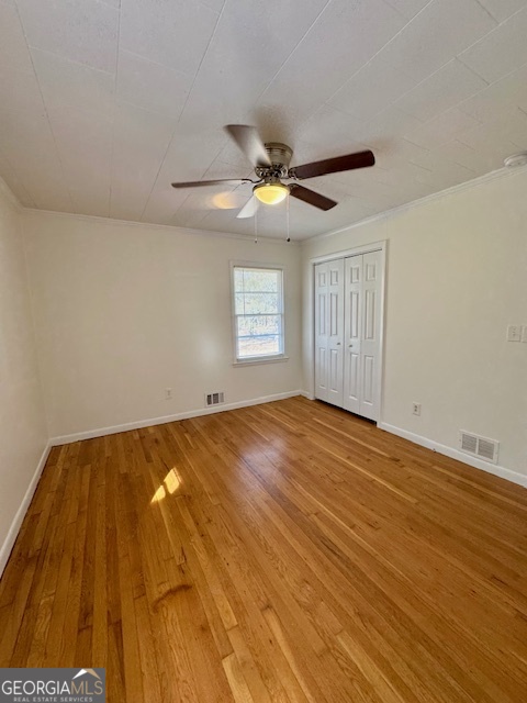449 Shankle Road Commerce, GA 30529 - Photo 12 of 15 a view of empty room with wooden floor and fan