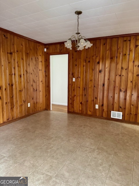 449 Shankle Road Commerce, GA 30529 - Photo 6 of 15 a view of a room with a door and a chandelier