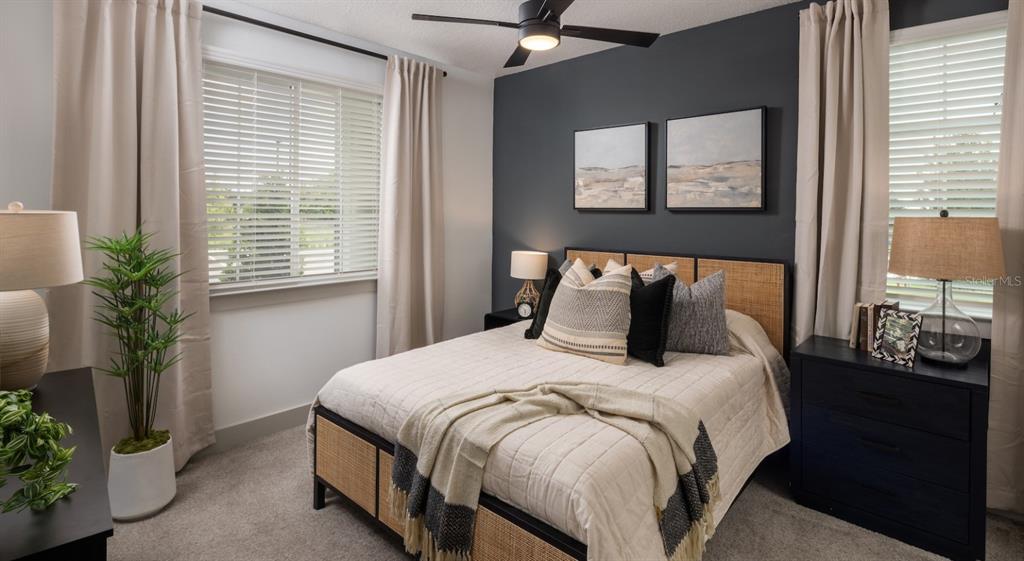 5000 Collina Terrace, Unit TH1 Clermont, FL 34711 - Photo 26 of 28 a bedroom with bed and windows