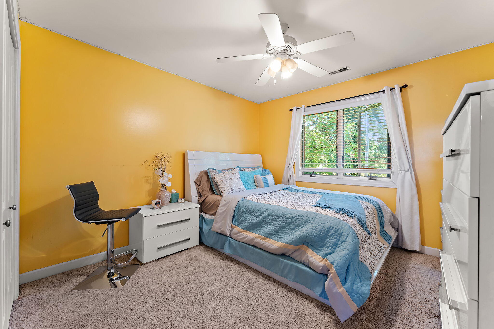 5371 72nd Avenue Schererville, IN 46375 - Photo 18 of 28 a bedroom with a bed and a chandelier