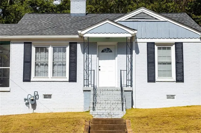 a bathroom with a tub and sink