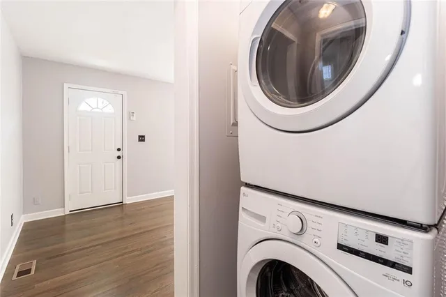 a view of a hallway with washer and dryer