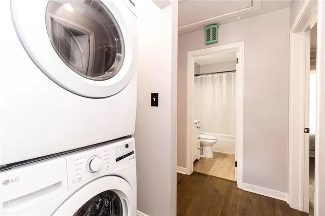 a view of a hallway with washer and dryer