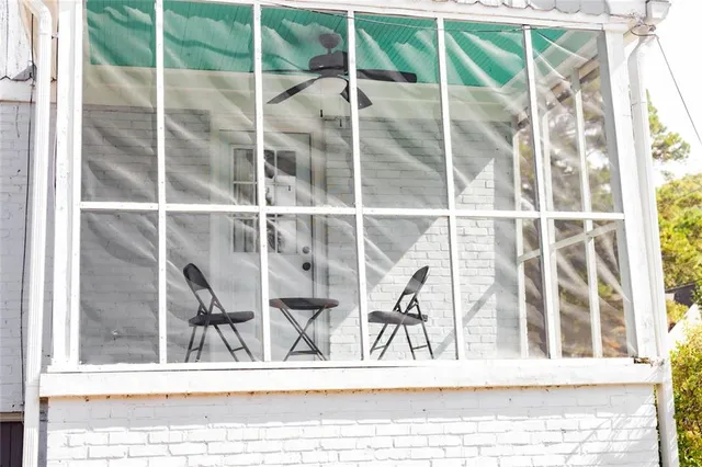 a view of a living room and window