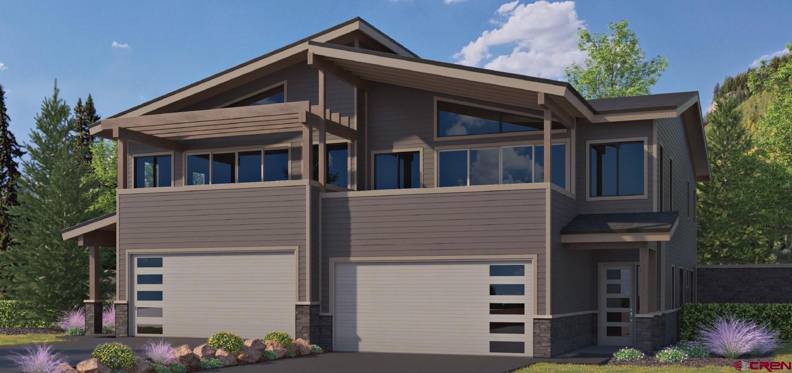 115 Travertine Trail, Unit PHASE III 4 Durango, CO 81301 - Photo 1 of 34 a front view of a house with plants