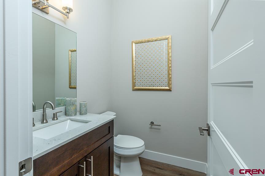 115 Travertine Trail, Unit PHASE III 4 Durango, CO 81301 - Photo 17 of 34 a bathroom with a sink toilet and a mirror