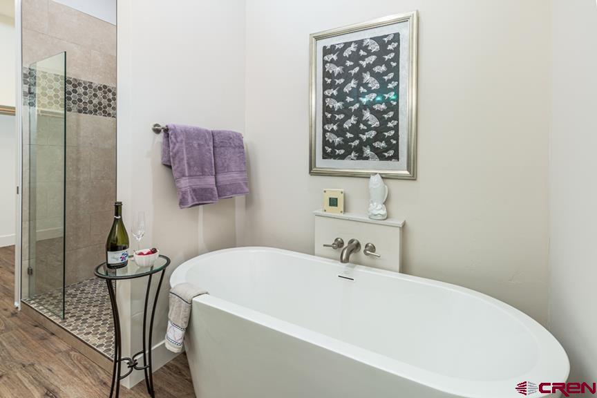 115 Travertine Trail, Unit PHASE III 4 Durango, CO 81301 - Photo 20 of 34 a bathroom with a bathtub and a sink