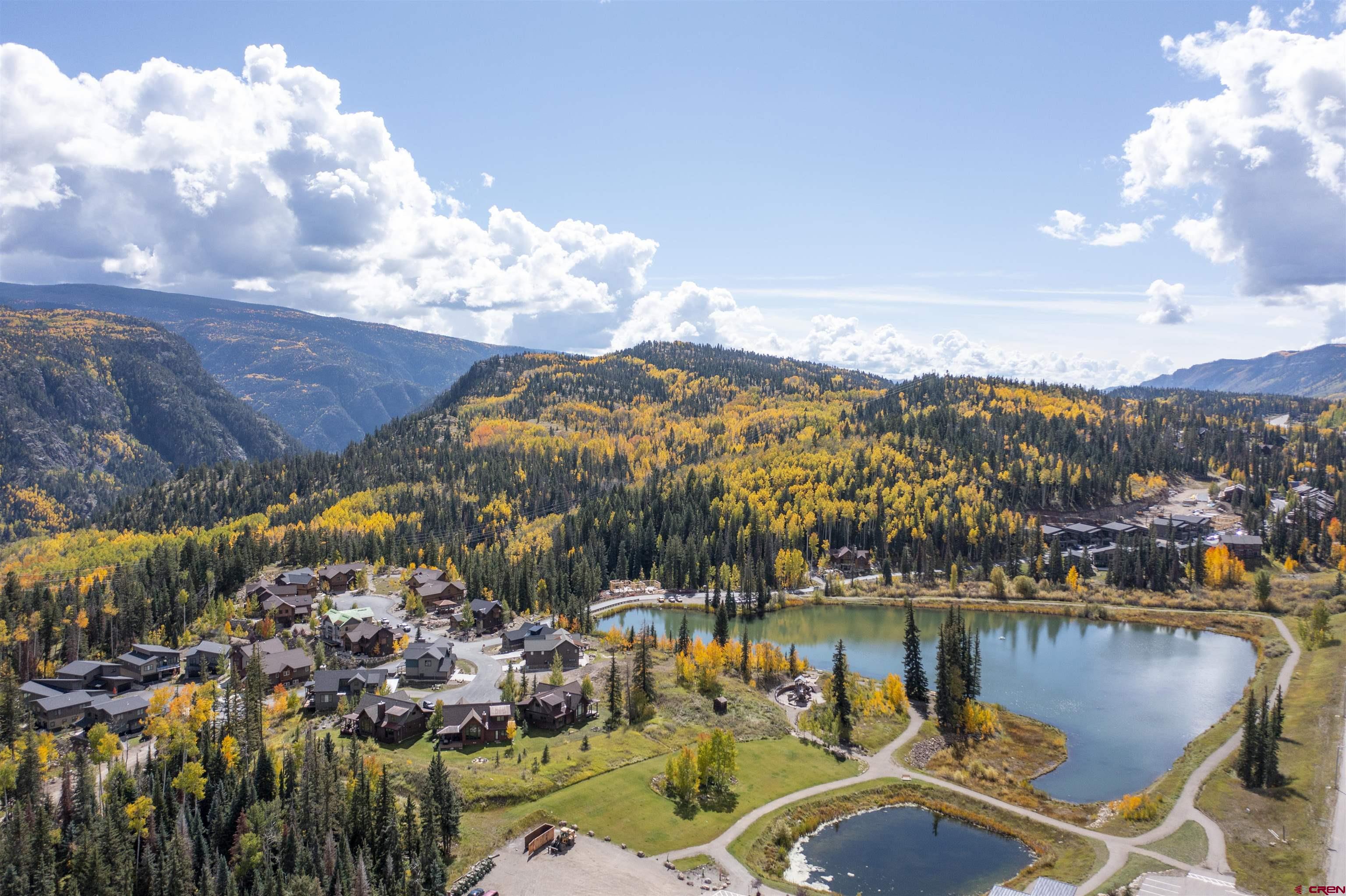 115 Travertine Trail, Unit PHASE III 4 Durango, CO 81301 - Photo 25 of 34 a view of a lake with a mountain