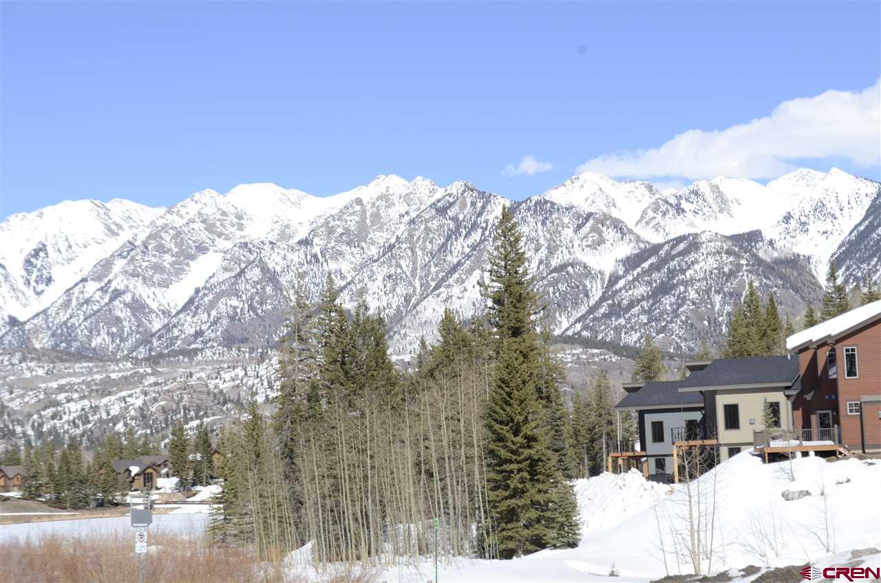 115 Travertine Trail, Unit PHASE III 4 Durango, CO 81301 - Photo 27 of 34 a view of a house with a snow in the background