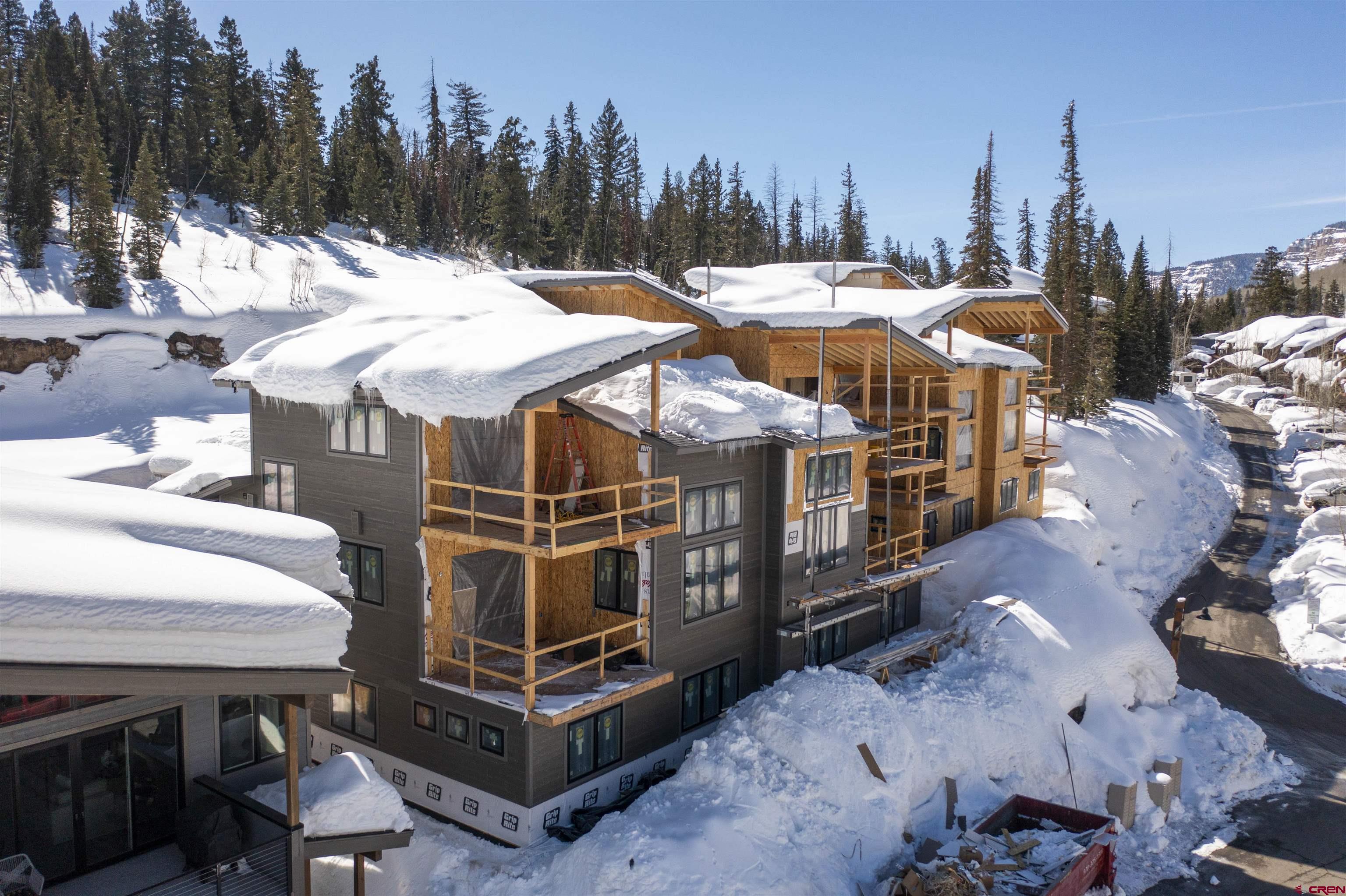 115 Travertine Trail, Unit PHASE III 4 Durango, CO 81301 - Photo 6 of 34 a view of a patio with a table and chairs