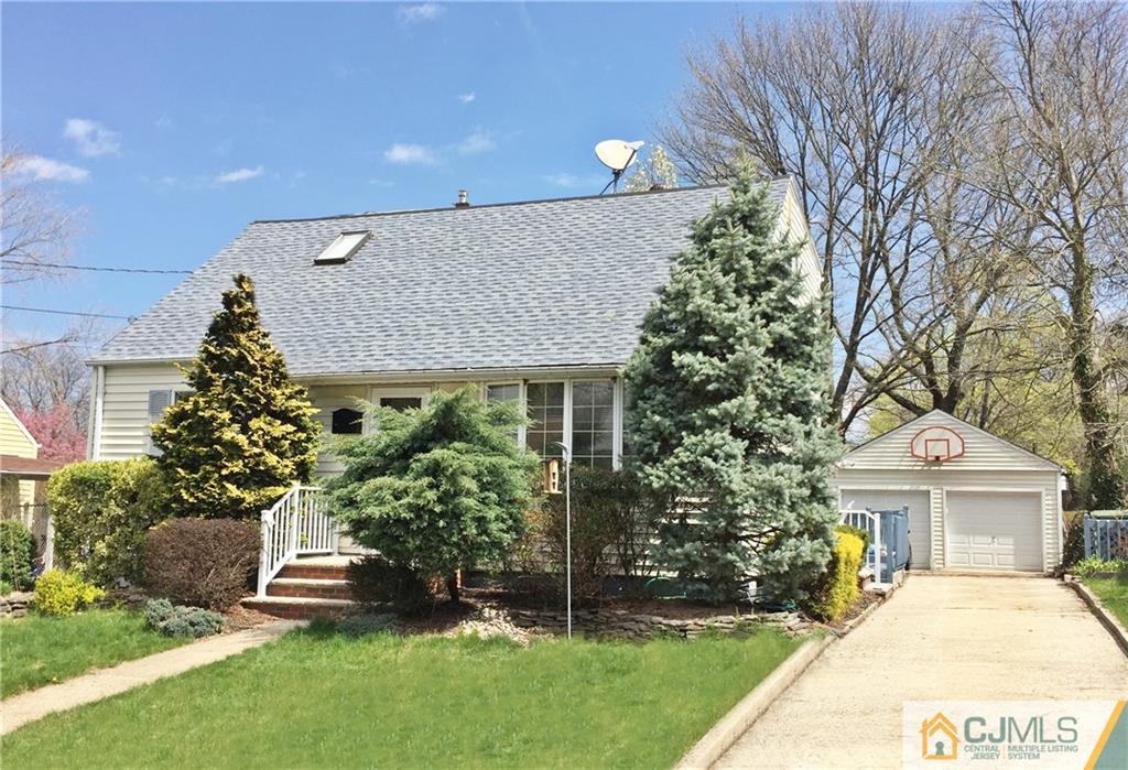 9 Sine Road Edison, NJ 08817 - Photo 1 of 21 a front view of a house with a garden and plants