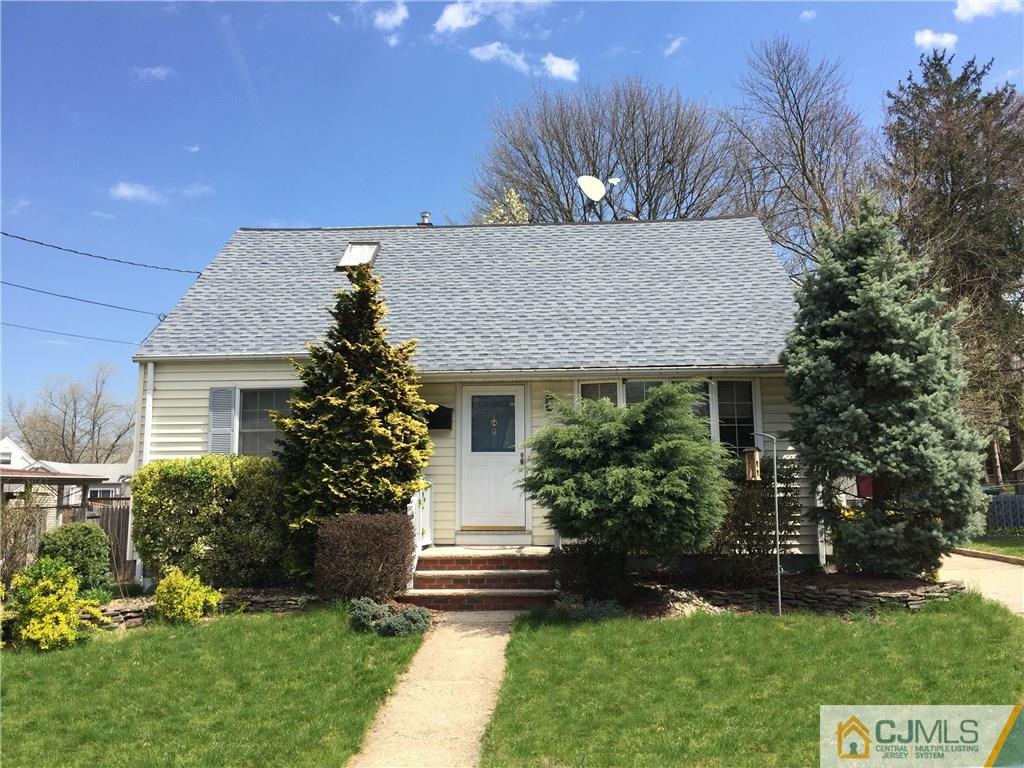 9 Sine Road Edison, NJ 08817 - Photo 2 of 21 a front view of a house with a garden and plants