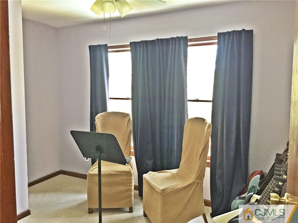 9 Sine Road Edison, NJ 08817 - Photo 11 of 21 a view of a balcony with chair and potted plant